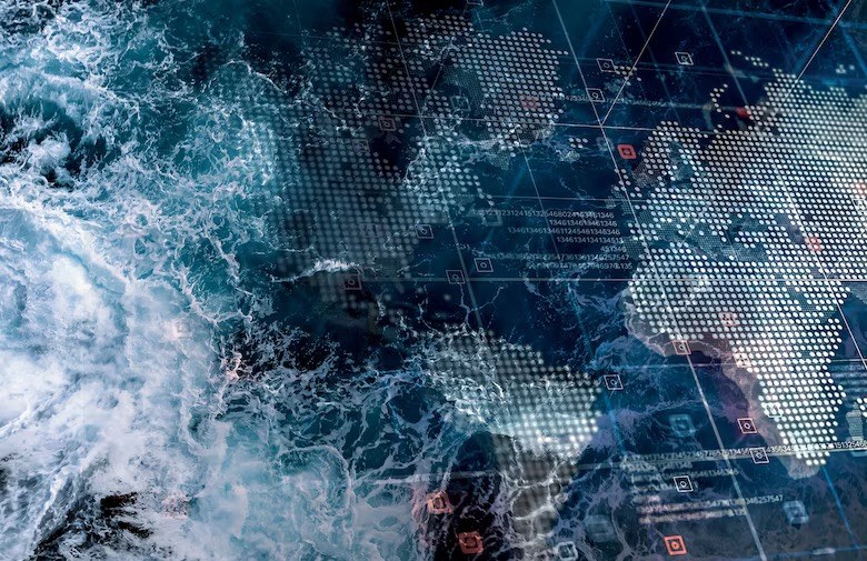 Aerial view of a stormy ocean overlaid with a glowing digital world map and data grid