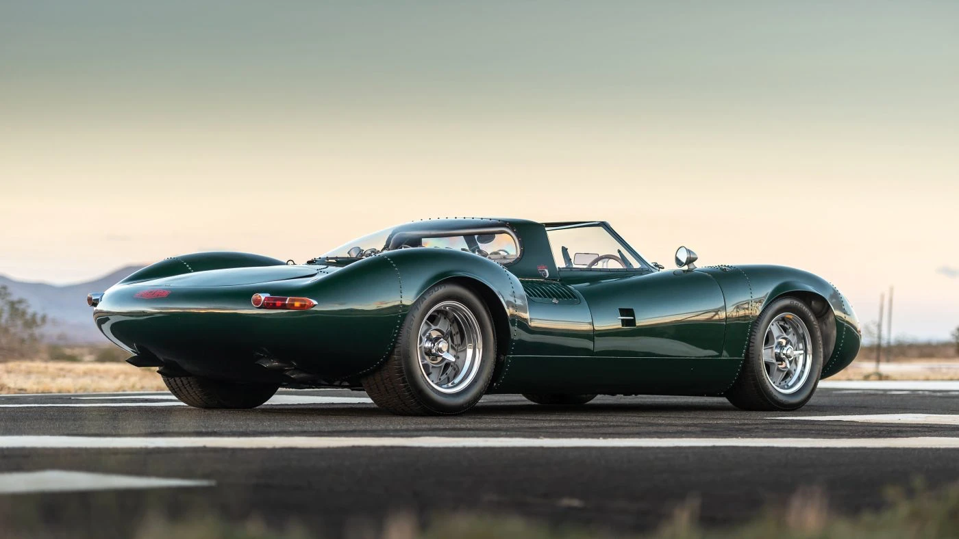 Rear three-quarter view of the Tempero XJ13 recreation, showing the tail and dual exhaust