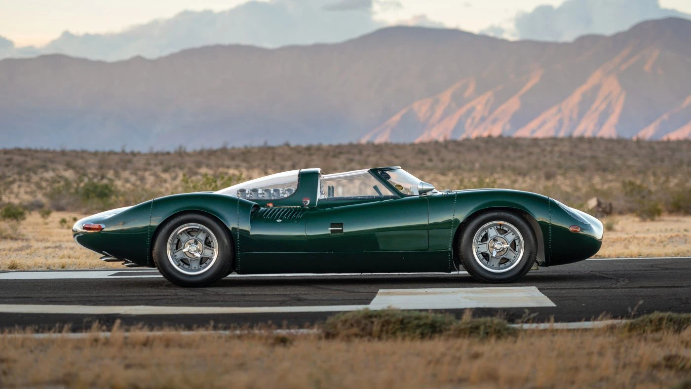 Full side profile of the Tempero XJ13 recreation on an airfield runway at dusk